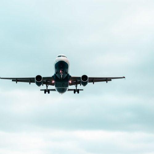 airplane flying up in the sky with a beautiful blue sky in the background