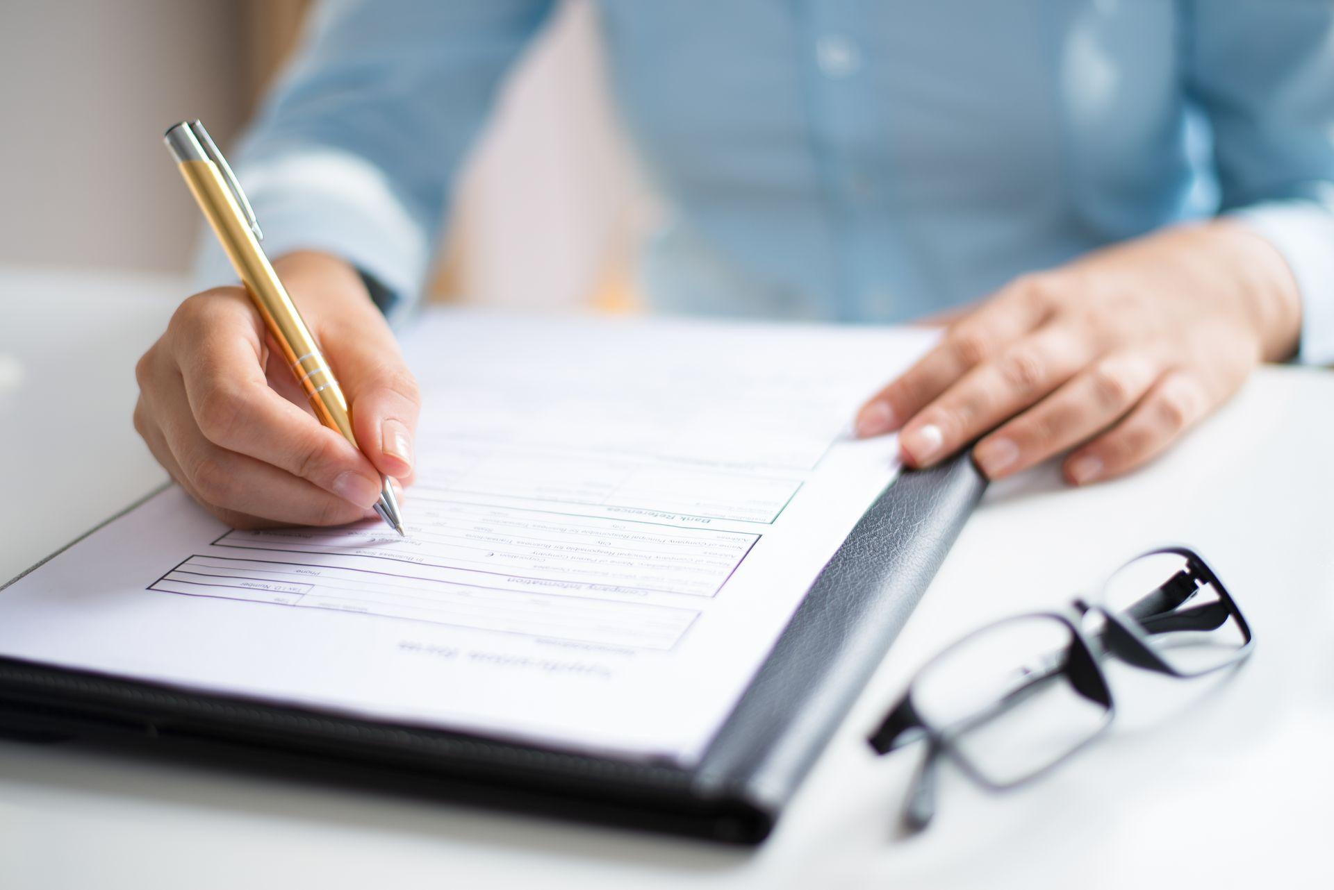 closeup of entrepreneur making notes in document