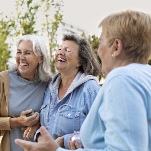 elderly friends playing petanque